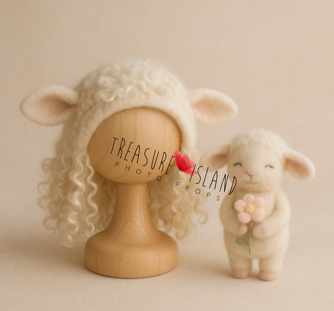 Hand-felted lamb bonnet with natural wool curls and miniature sheep newborn photography prop