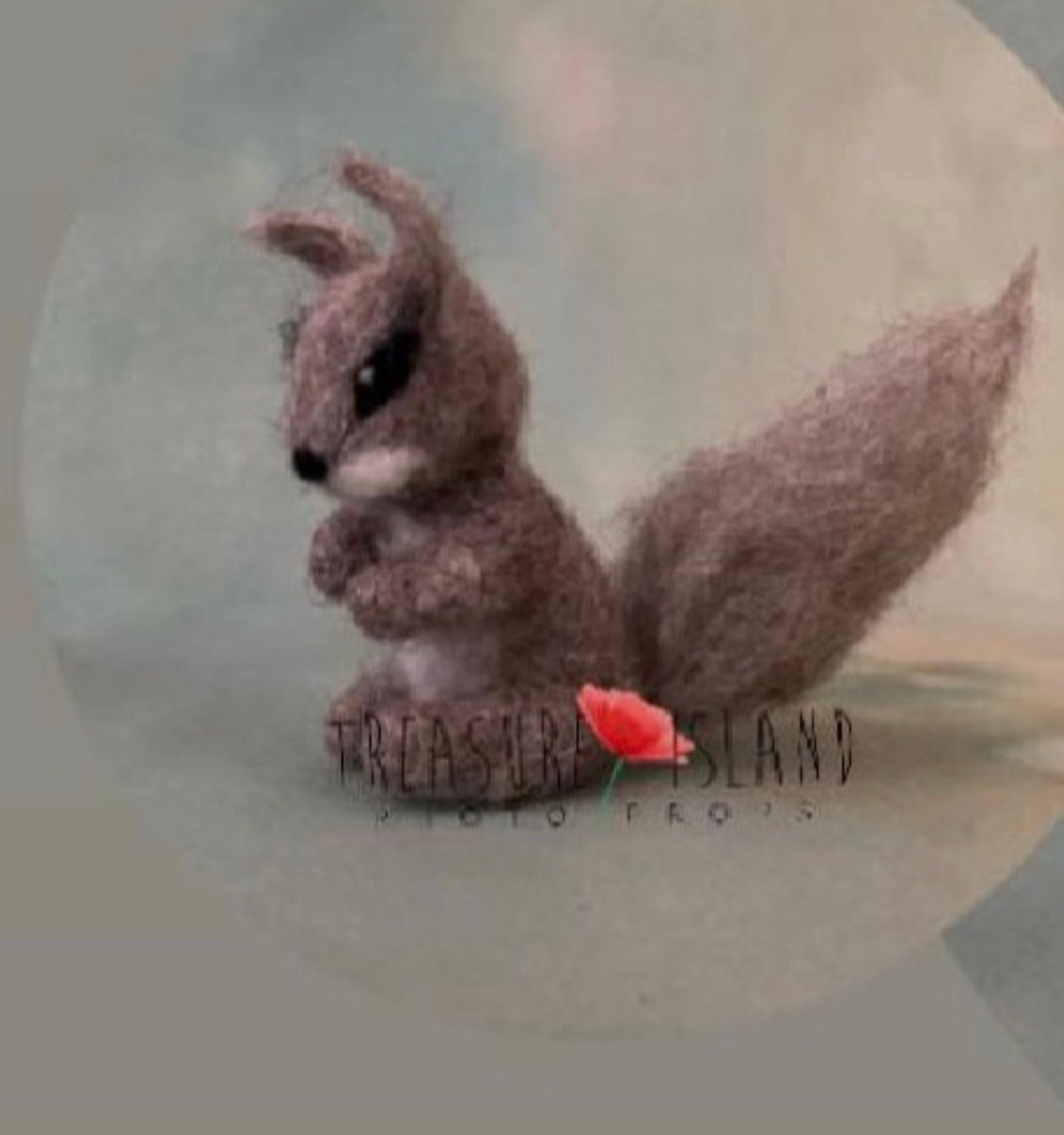 Side view of needle-felted squirrel companion with large sculpted wool tail