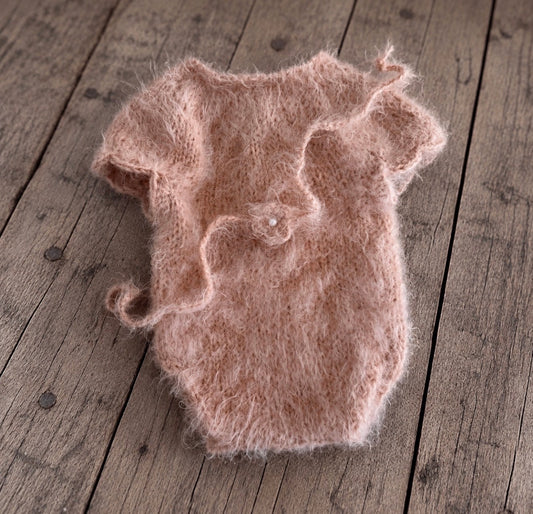 Soft dusty pink fluffy knitted bodysuit with short sleeves and matching flower headband featuring a small pearl-like centre.