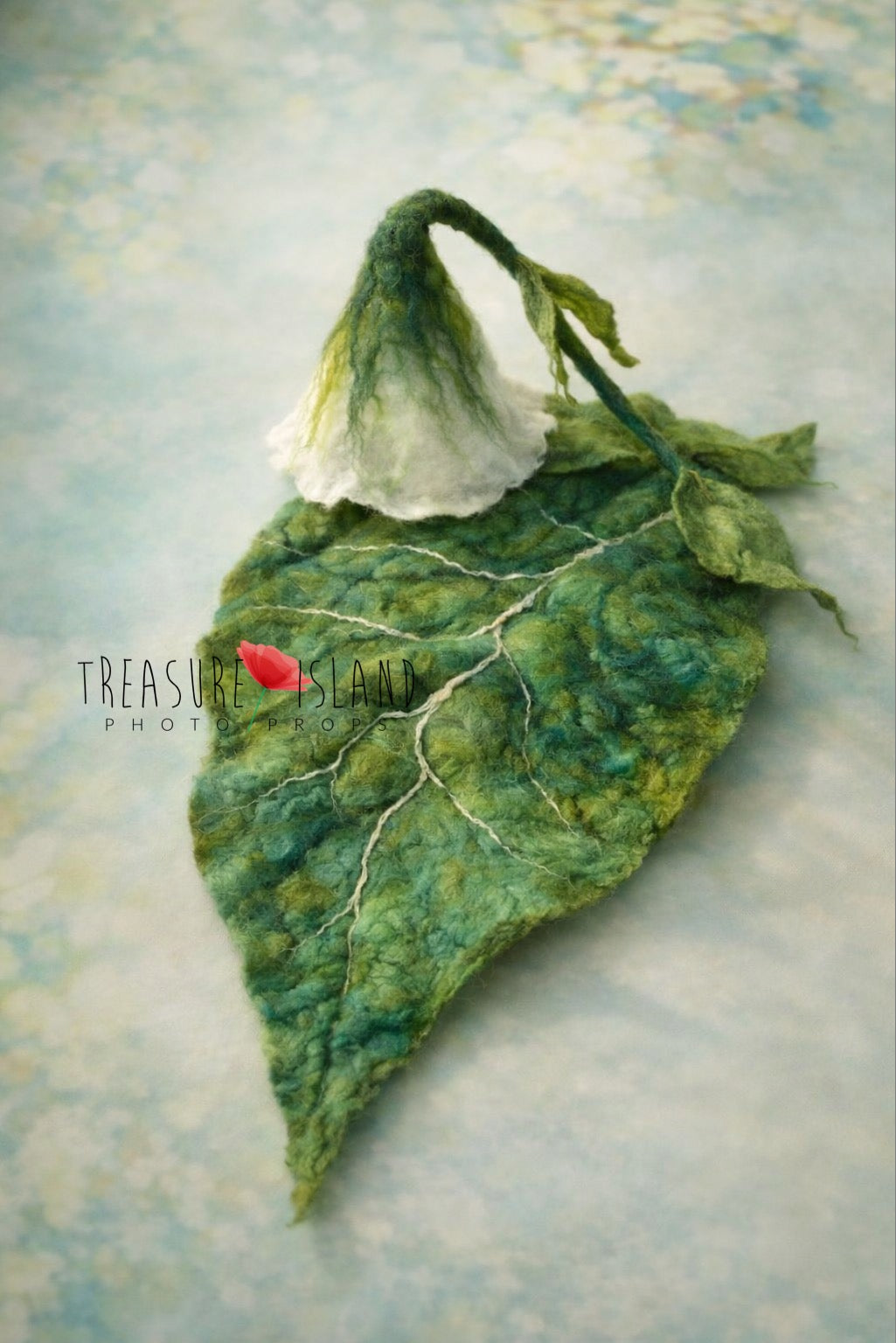 Forest Whisper hand-felted flower hat with long leafy stem and large botanical leaf base for newborn photography