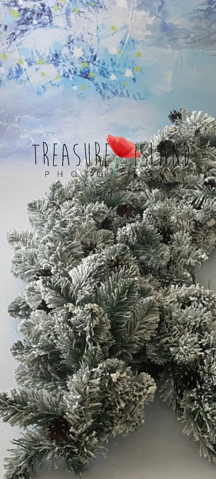 Close-up of frosted evergreen branches and natural pinecones on a snowy Christmas garland