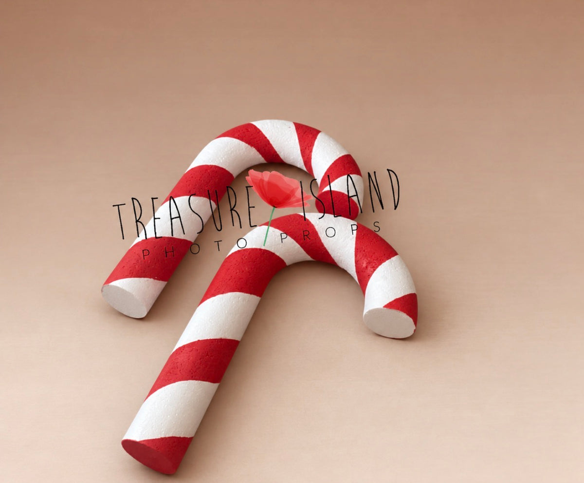 Giant red and white Candy Cane props for Christmas newborn and sitter photography setups