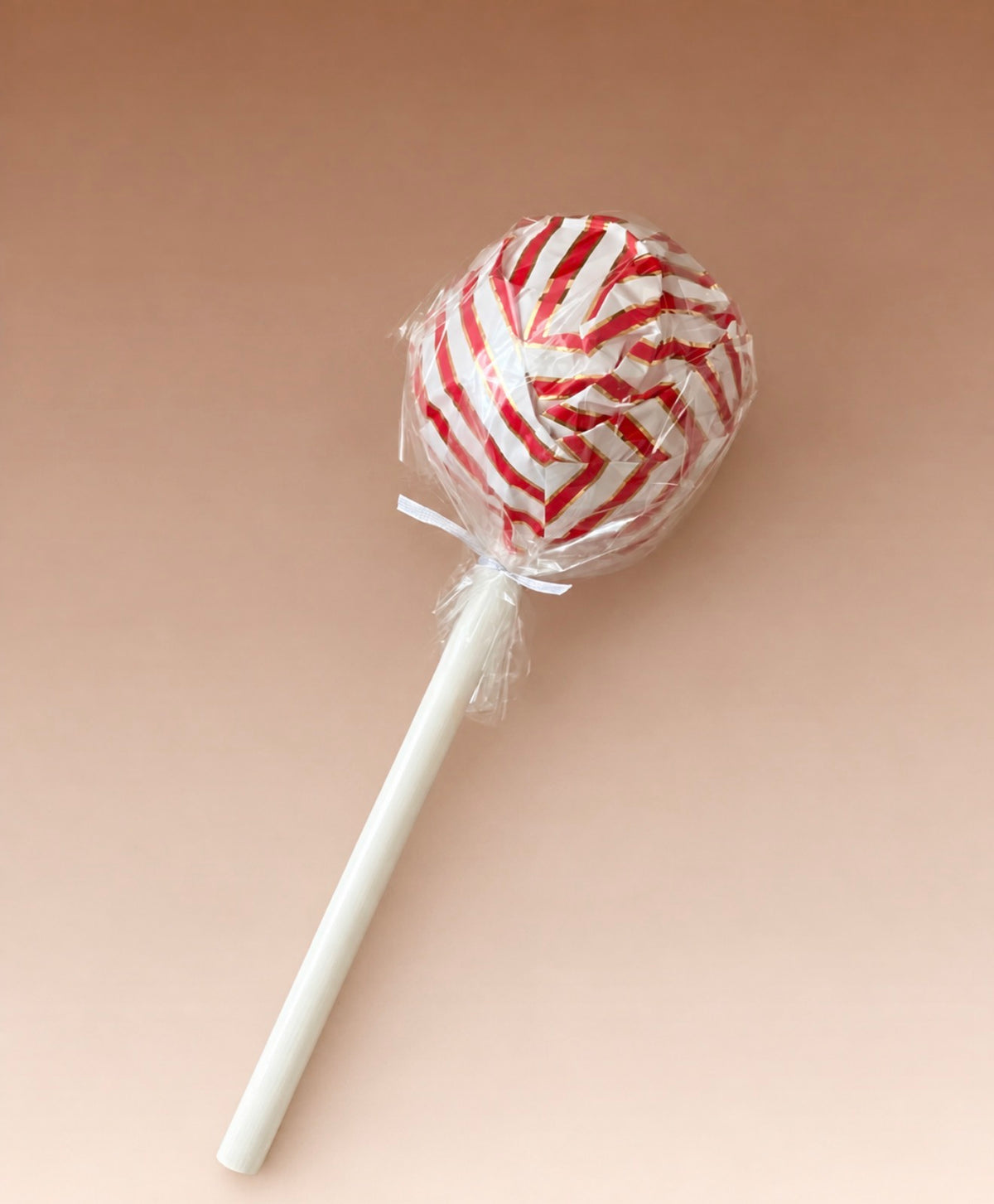 Giant wrapped red and white lollipop prop for Christmas photography sessions