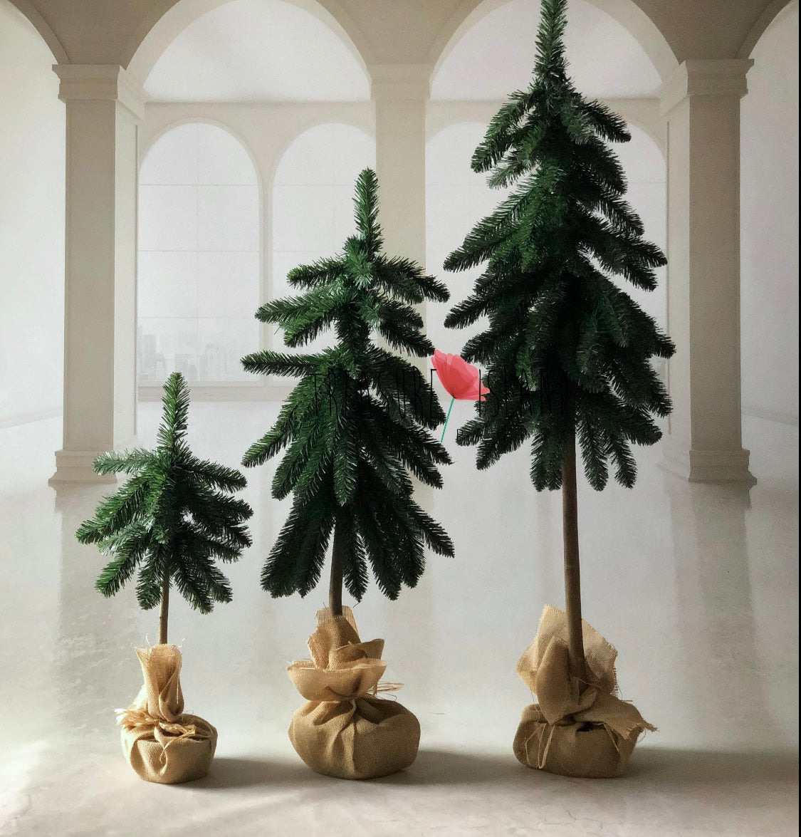 Three handmade green Christmas tree props in different heights for studio photography
