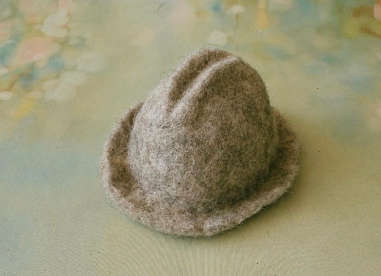 Green and olive blended hand-felted wool photography hat with soft tonal transitions