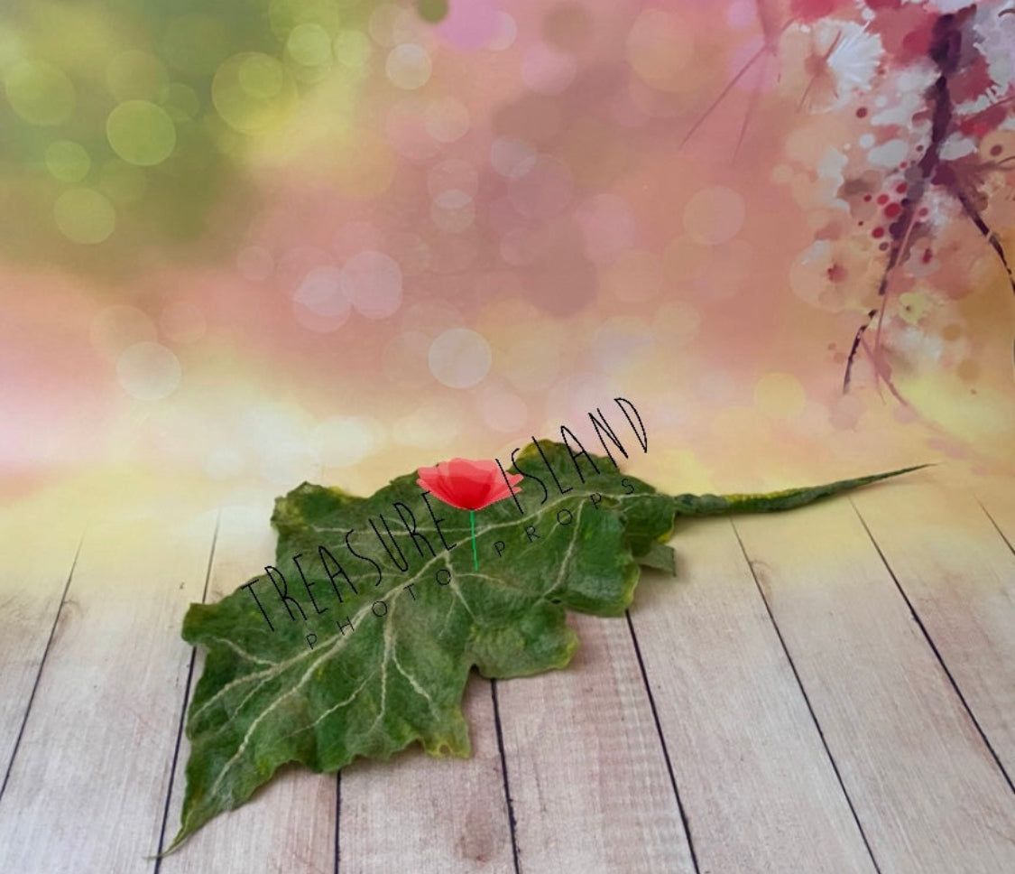 Large hand-felted green botanical leaf with sculpted edges, natural veins and long stem