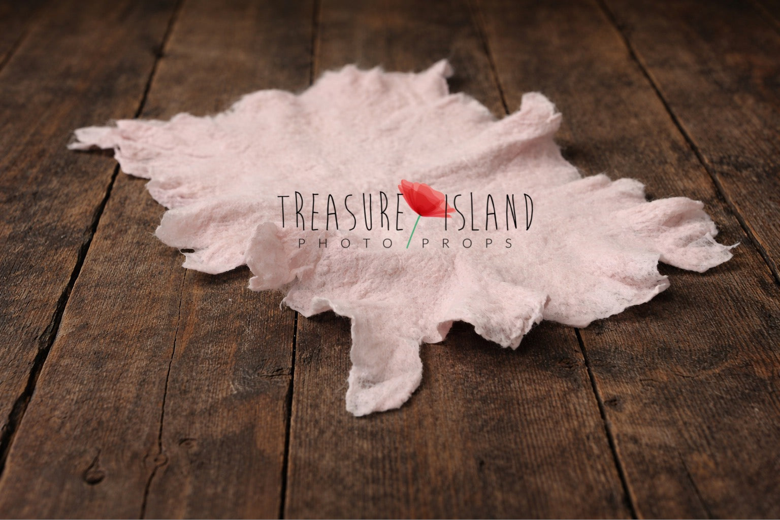 Very light pink hand-felted irregular wool blanket with organic edges