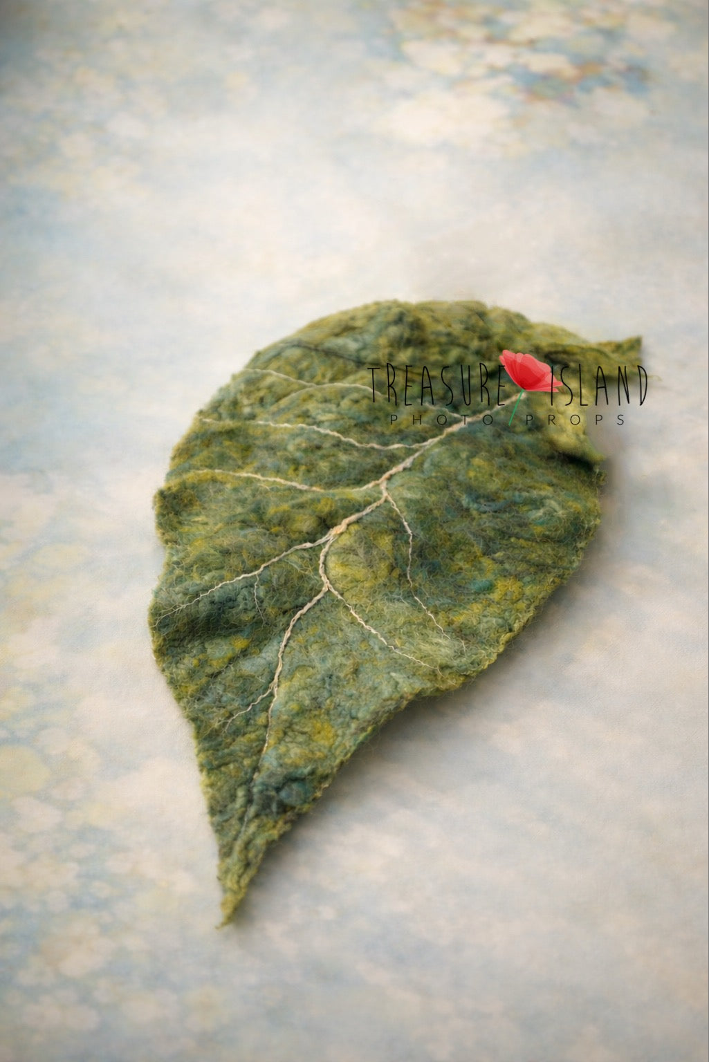Hand-felted green botanical leaf with natural vein details for newborn photography styling