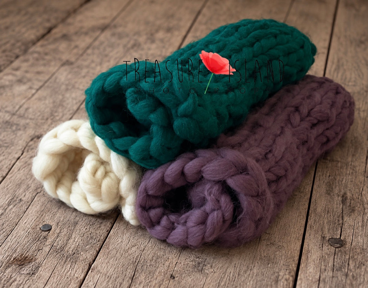 Hand-knitted chunky newborn photography blankets displayed in three colour options