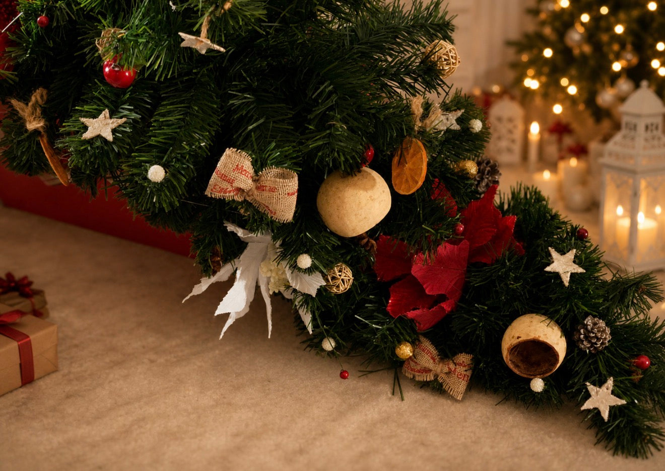 Handcrafted Christmas garland with evergreen foliage, poinsettias, pinecones and natural decorative accents
