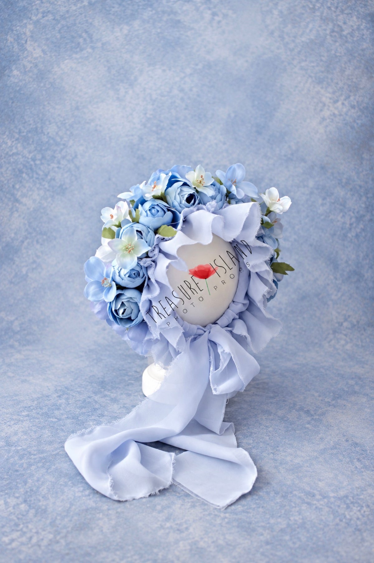 Blue floral bonnet with layered roses and delicate flowers for newborn and sitter photography