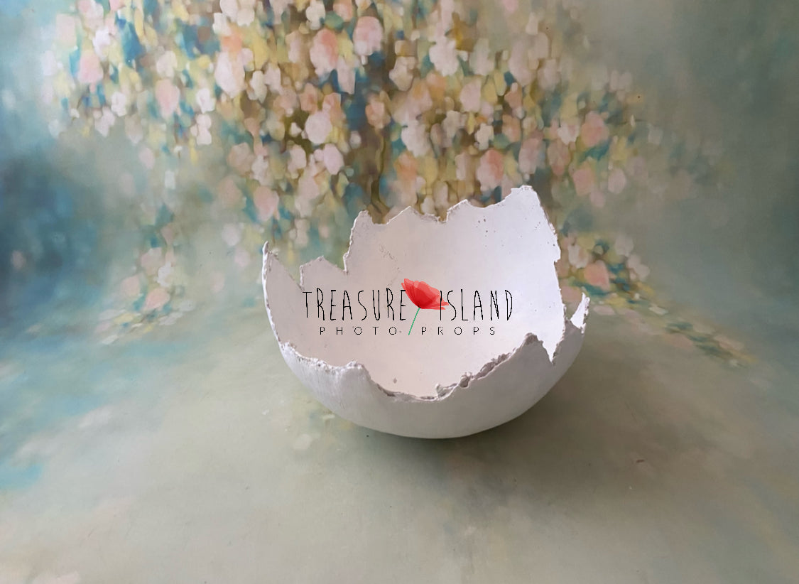 Handmade plaster Easter eggshell photographed in a fine art studio setting