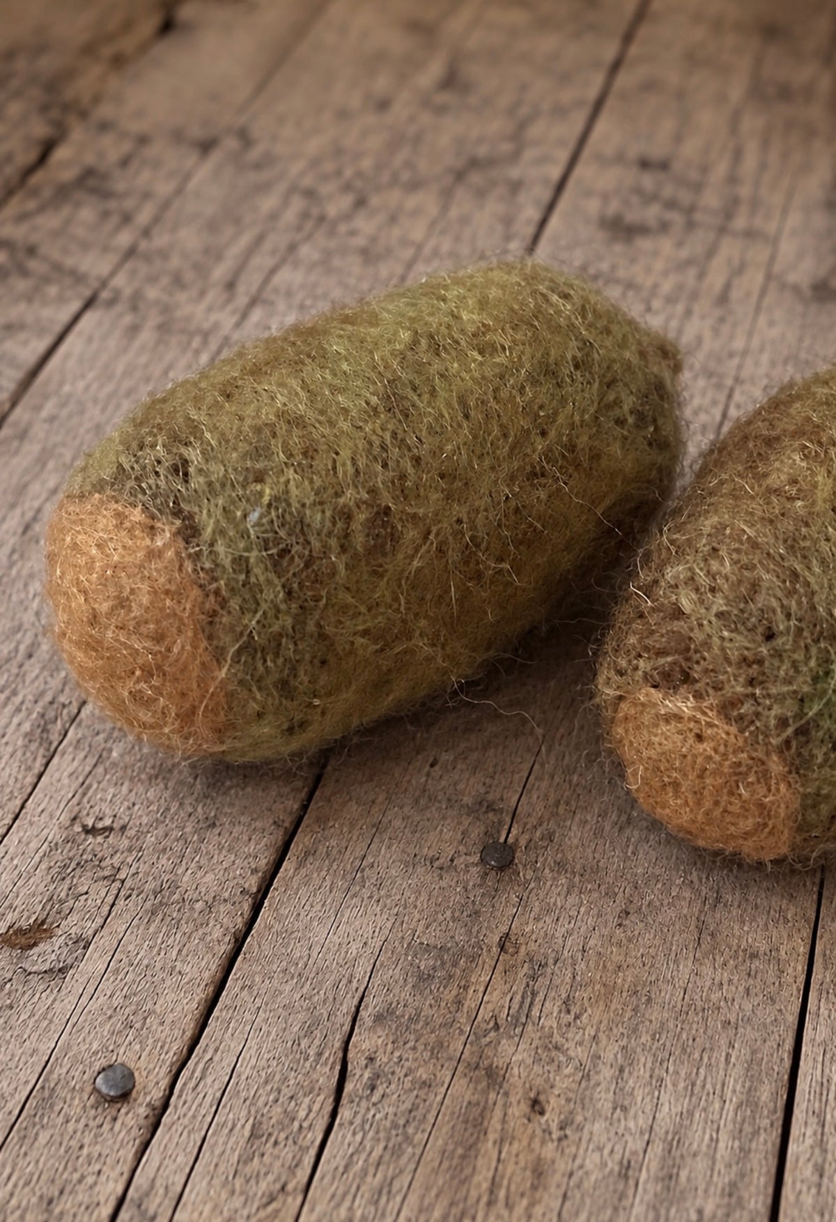 Handmade felted acorns in earthy woodland colors for newborn and sitter photography setups