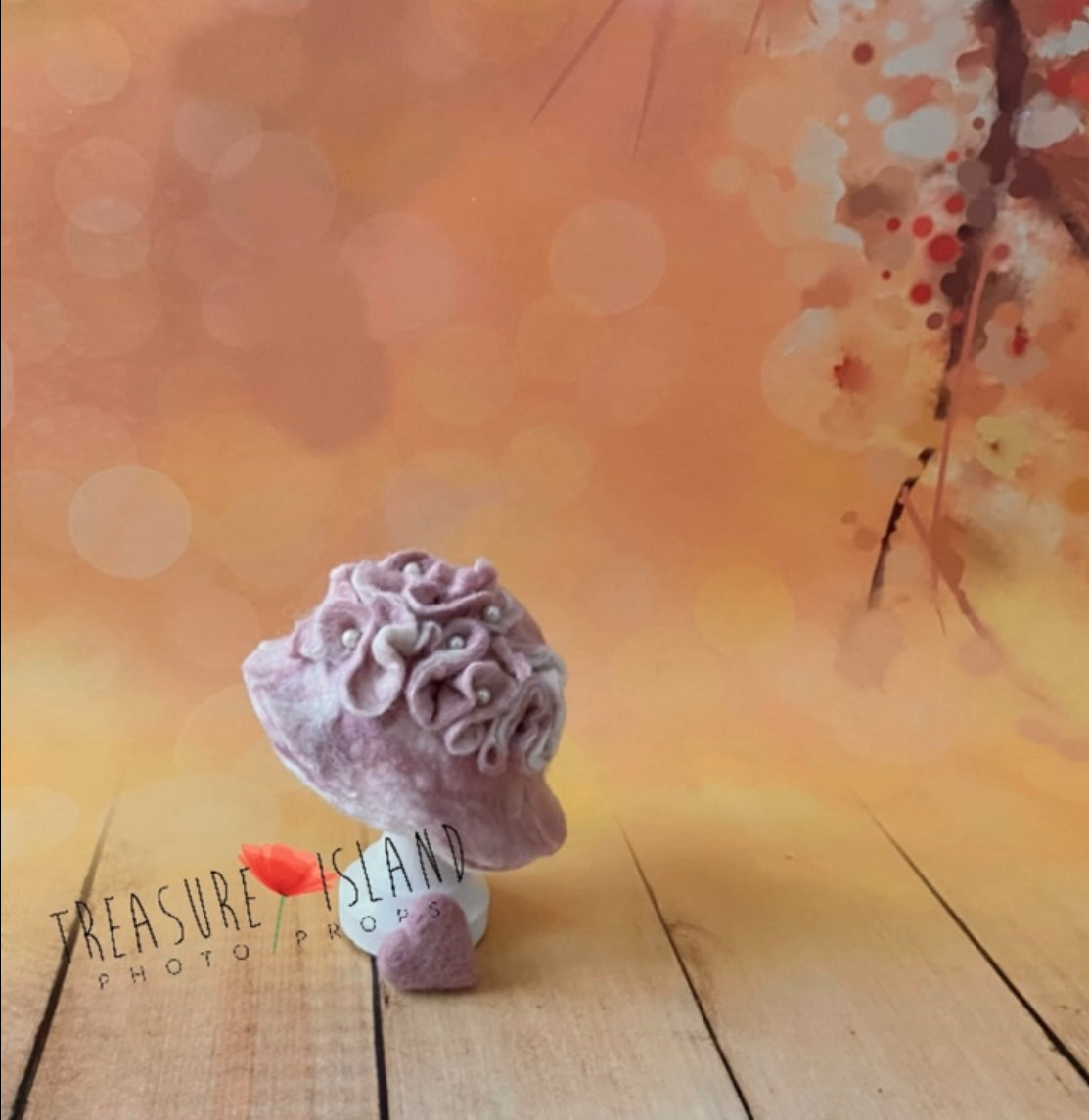 Hand-felted pink floral photography bonnet showing sculptural wool flowers and pearl details