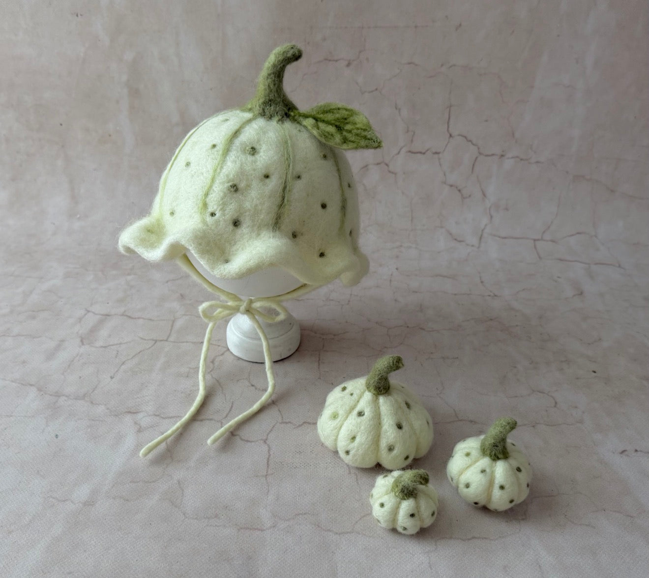 Hand-felted ivory pumpkin bonnet with three matching mini pumpkins for newborn photography