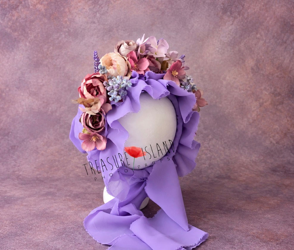 Handmade lavender floral bonnet with flowing fabric ties and romantic flowers for fine art photography