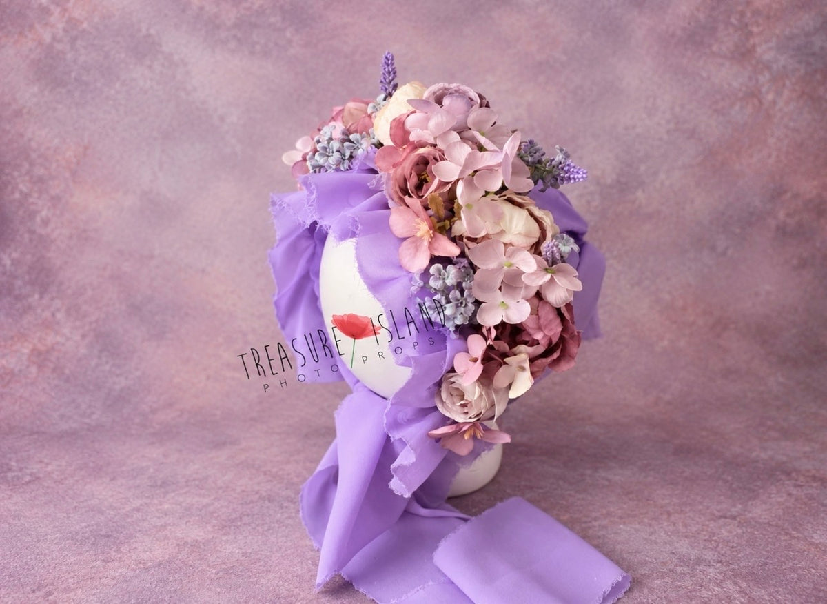 Side view of lavender photography bonnet with layered pink, mauve and purple floral arrangement