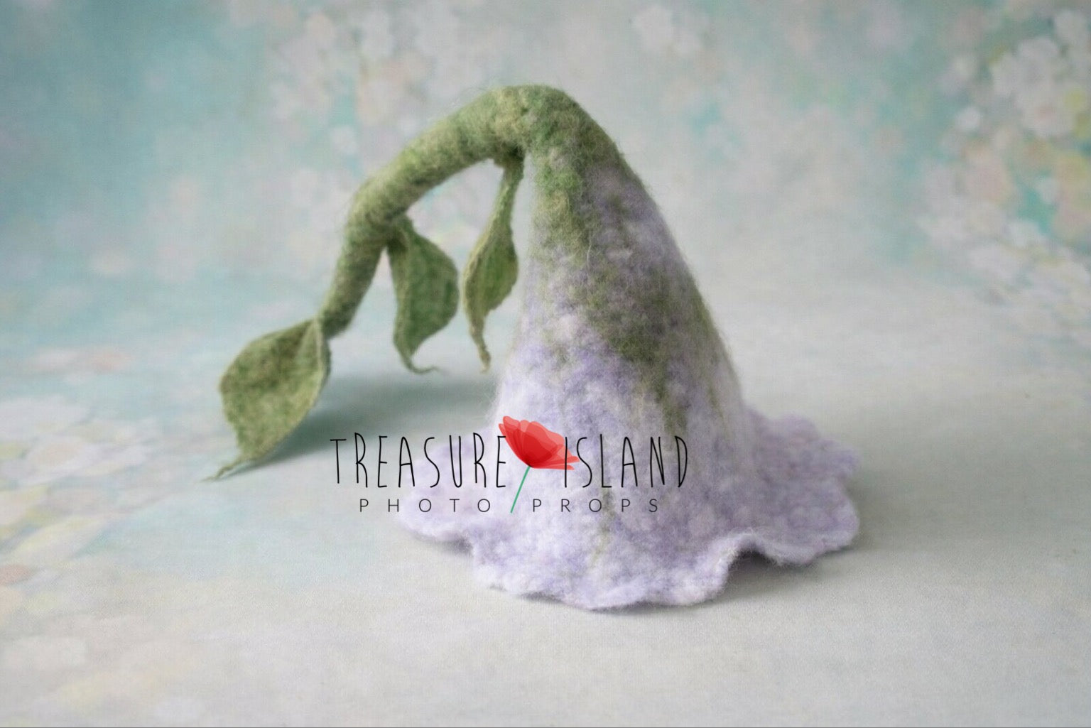 Light lilac hand-felted flower hat with long green stalk and sculpted leaves for newborn photography