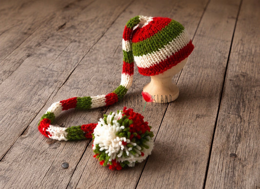 Hand-knitted red, green and white long tail Elf hat with pom pom for newborn and sitter Christmas photography.