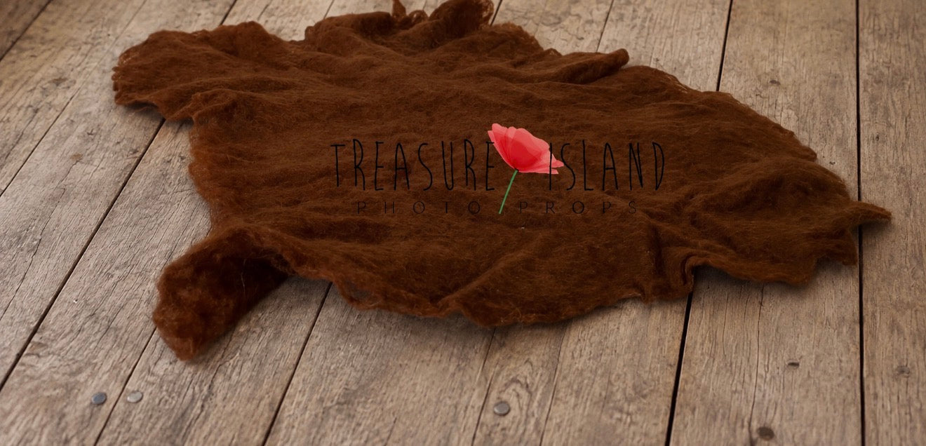 Milk chocolate hand-felted irregular wool blanket with natural textured surface for newborn photography