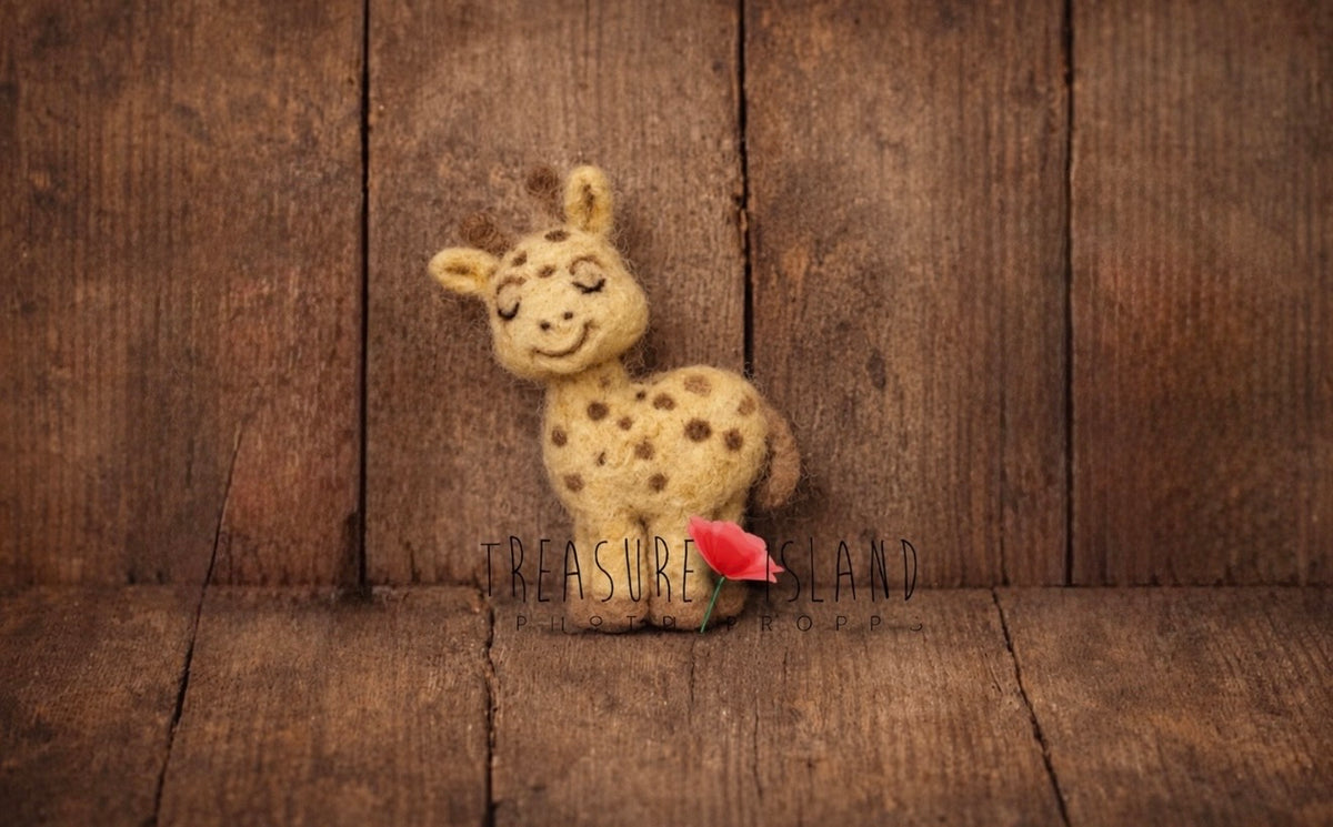 Mini hand-felted giraffe made from natural wool for newborn Safari photography