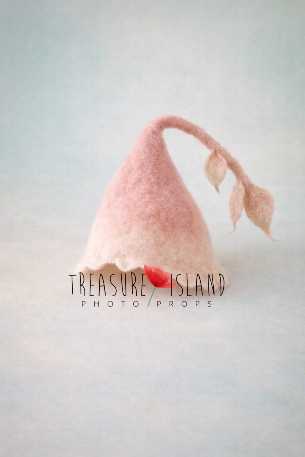Hand-felted Moon Whisper botanical newborn bonnet with blush ombre and delicate leaves