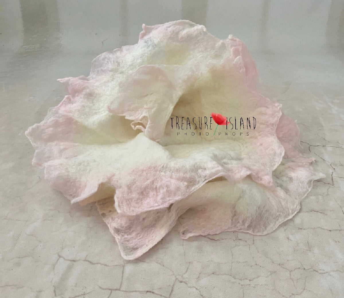 Natural white hand-felted newborn wrap with blush pink edges for fine art photography