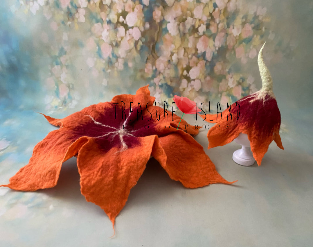 Orange and burgundy hand-felted lily flower bonnet with matching leaf photography blanket