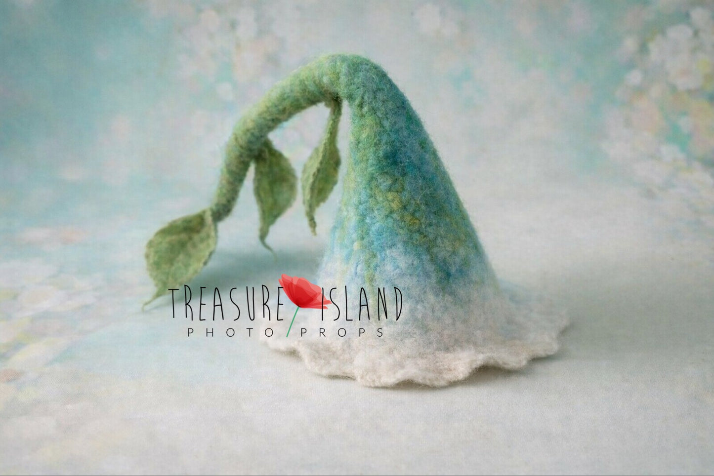 Pastel blue hand-felted flower hat with long green stalk and leaves for newborn photography
