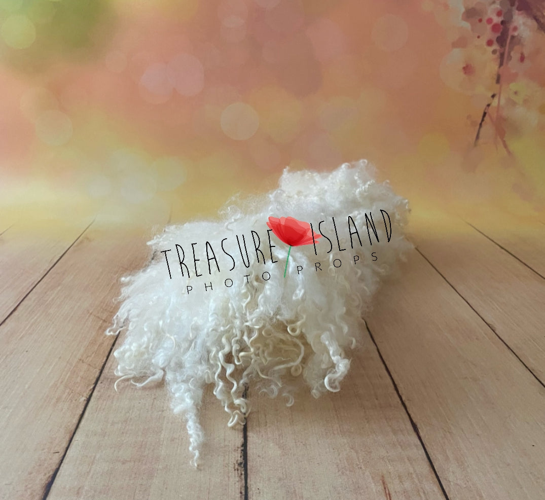 Hand-felted Pearl White photography blanket with natural sheep curls displayed flat