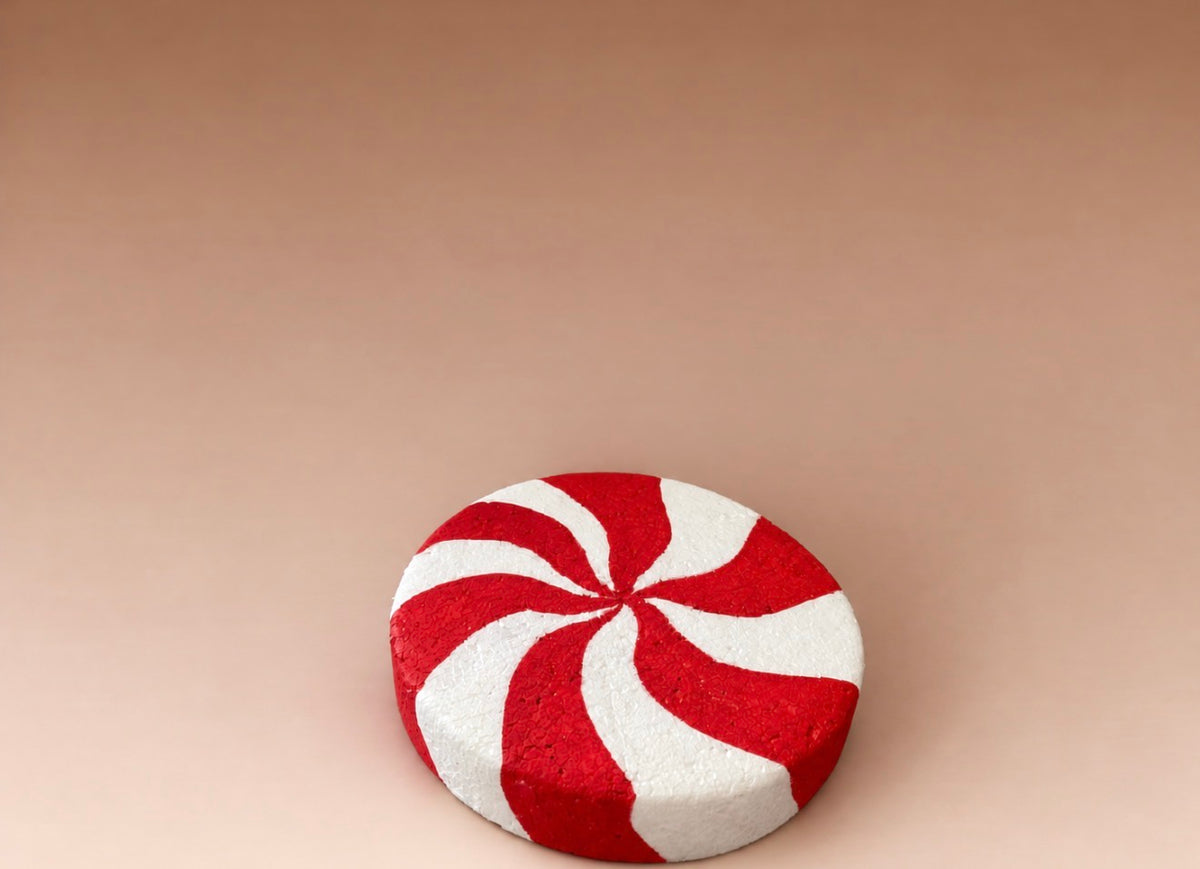 Handmade red and white peppermint candy photography prop for festive Christmas sessions