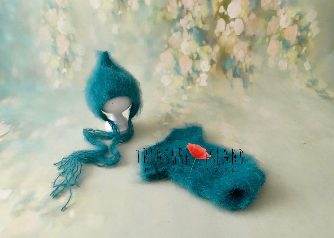 Petrol blue knitted romper and fluffy Imp Hat set for newborn photography styling