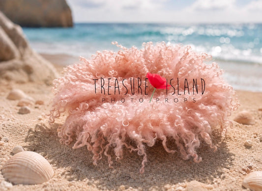 Pink curly wool blanket with natural sheep locks for newborn photography, handmade Treasure Island photo prop styled by the ocean