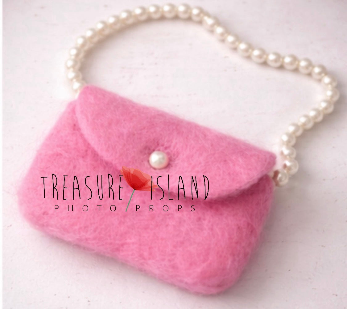 Hand-felted miniature pink handbag with pearl-style handle for newborn photography styling