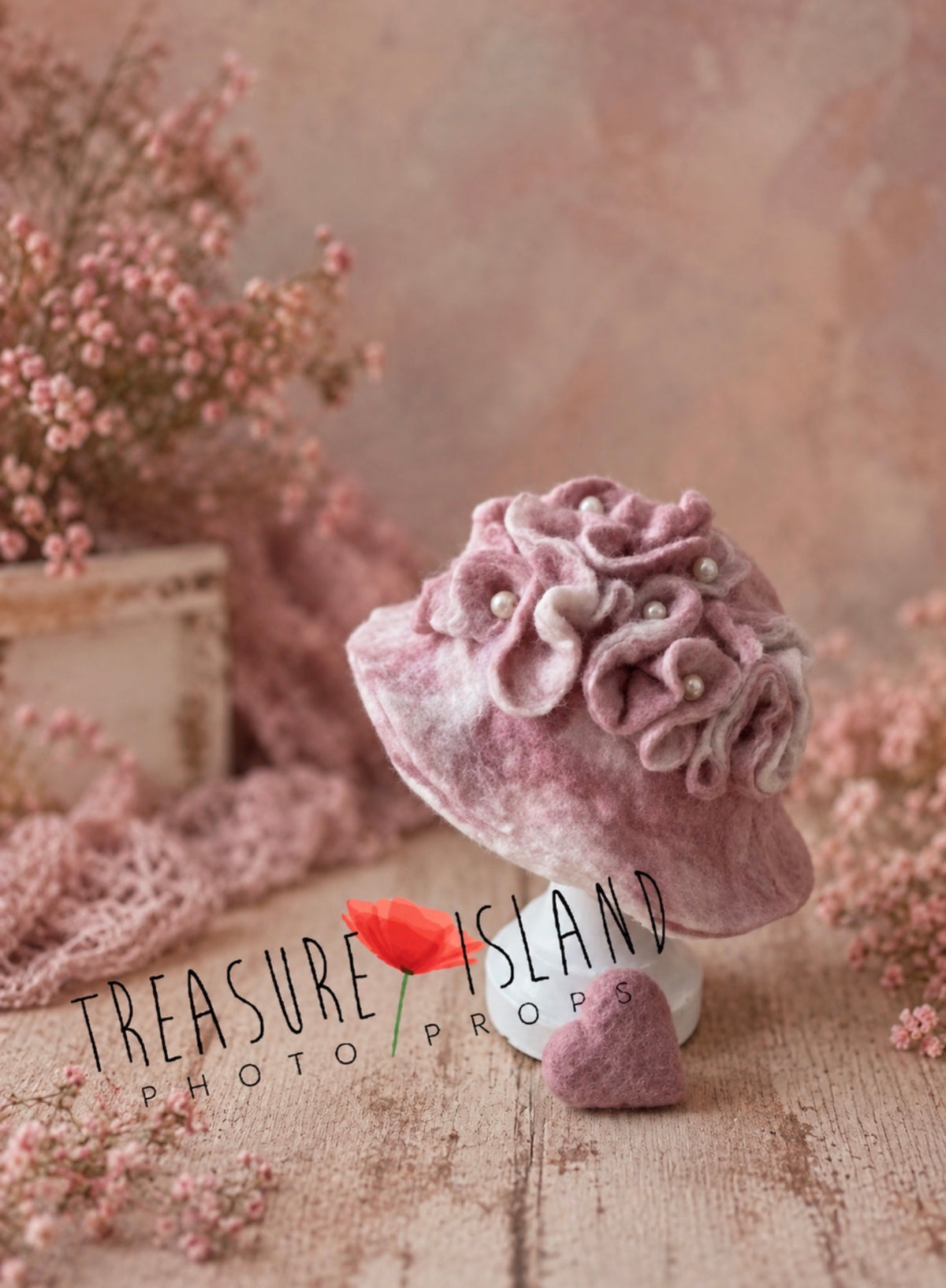 Handmade pink wool bonnet decorated with felted flowers and delicate pearl embellishments