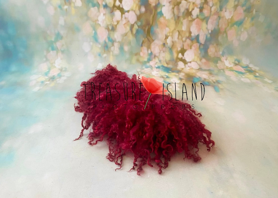 Red curly sheep locks photography layer styled on a pastel fine art backdrop