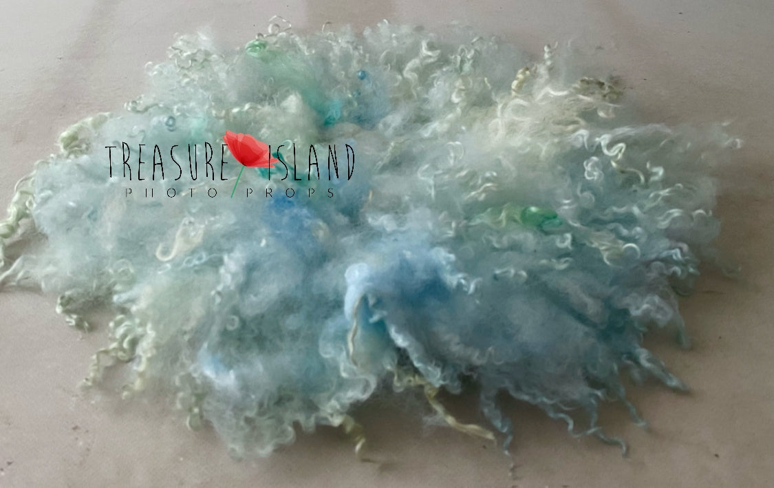 Sea Glass hand-felted wool photography blanket with natural sheep curls in aqua, blue and seafoam