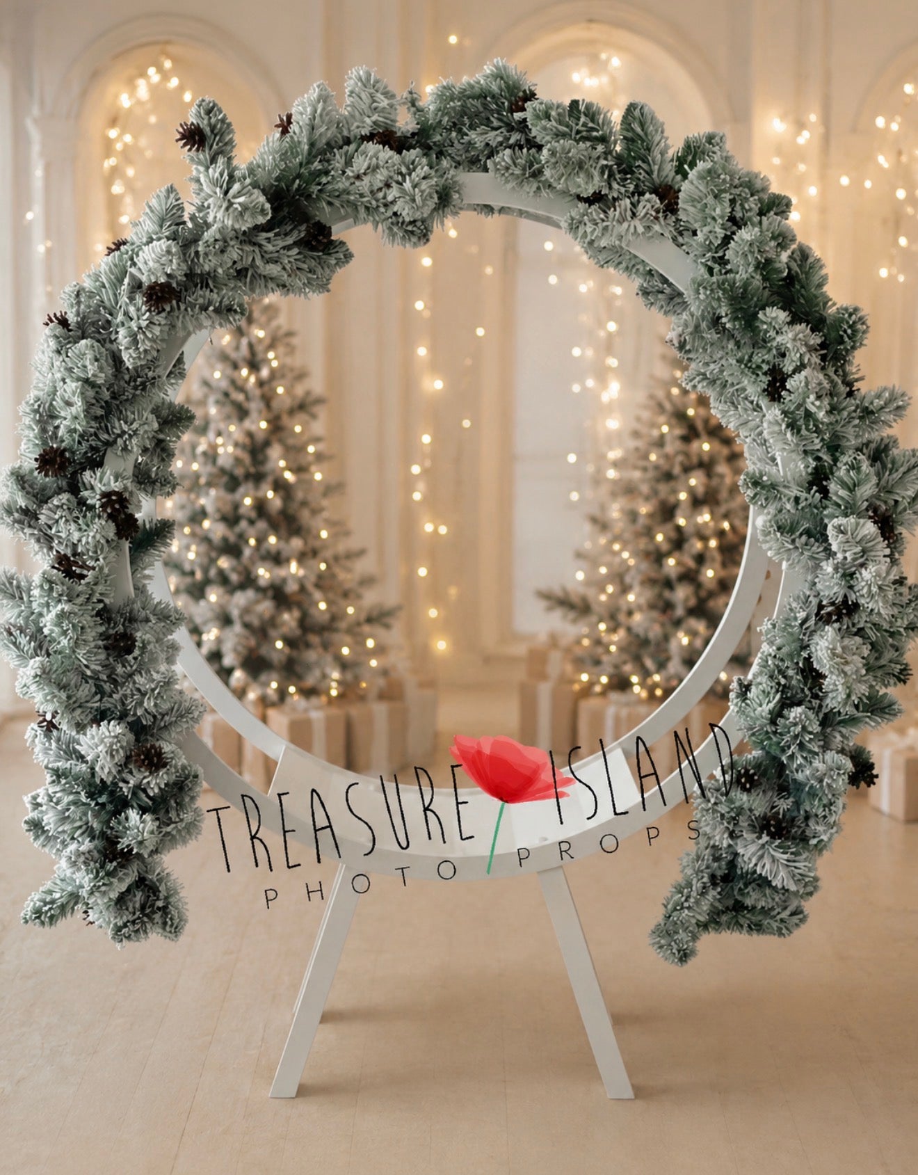 Snowy Christmas garland arranged around a circular frame for holiday photography mini sessions