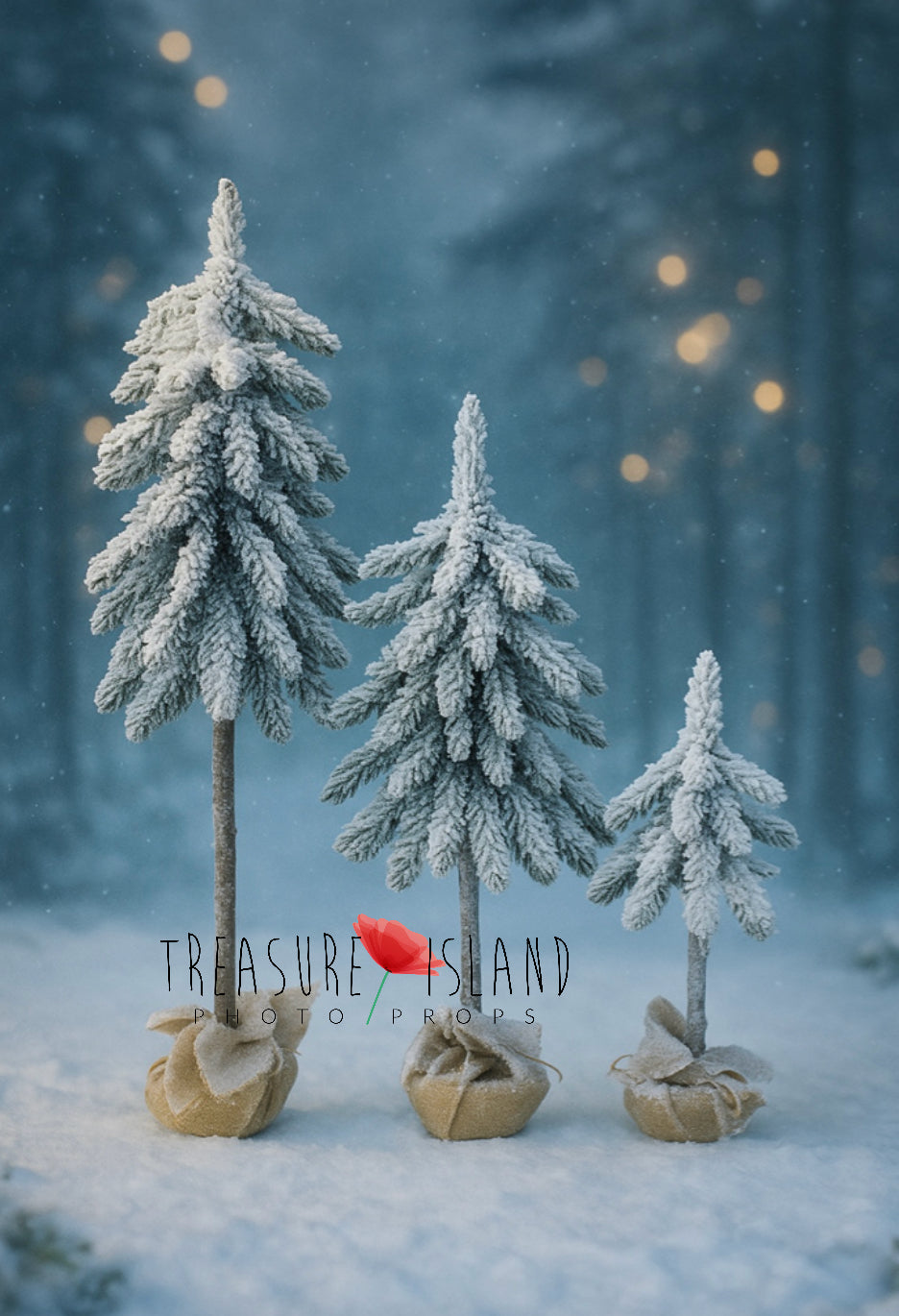 Three handmade snowy Christmas trees in different heights for festive studio photography