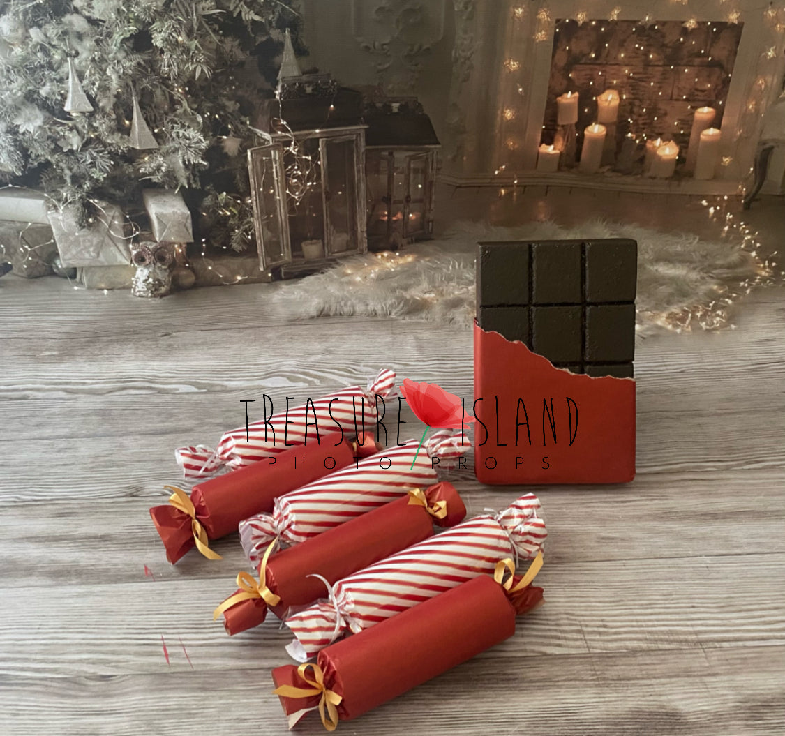 Red and white striped giant wrapped candy props for festive photography
