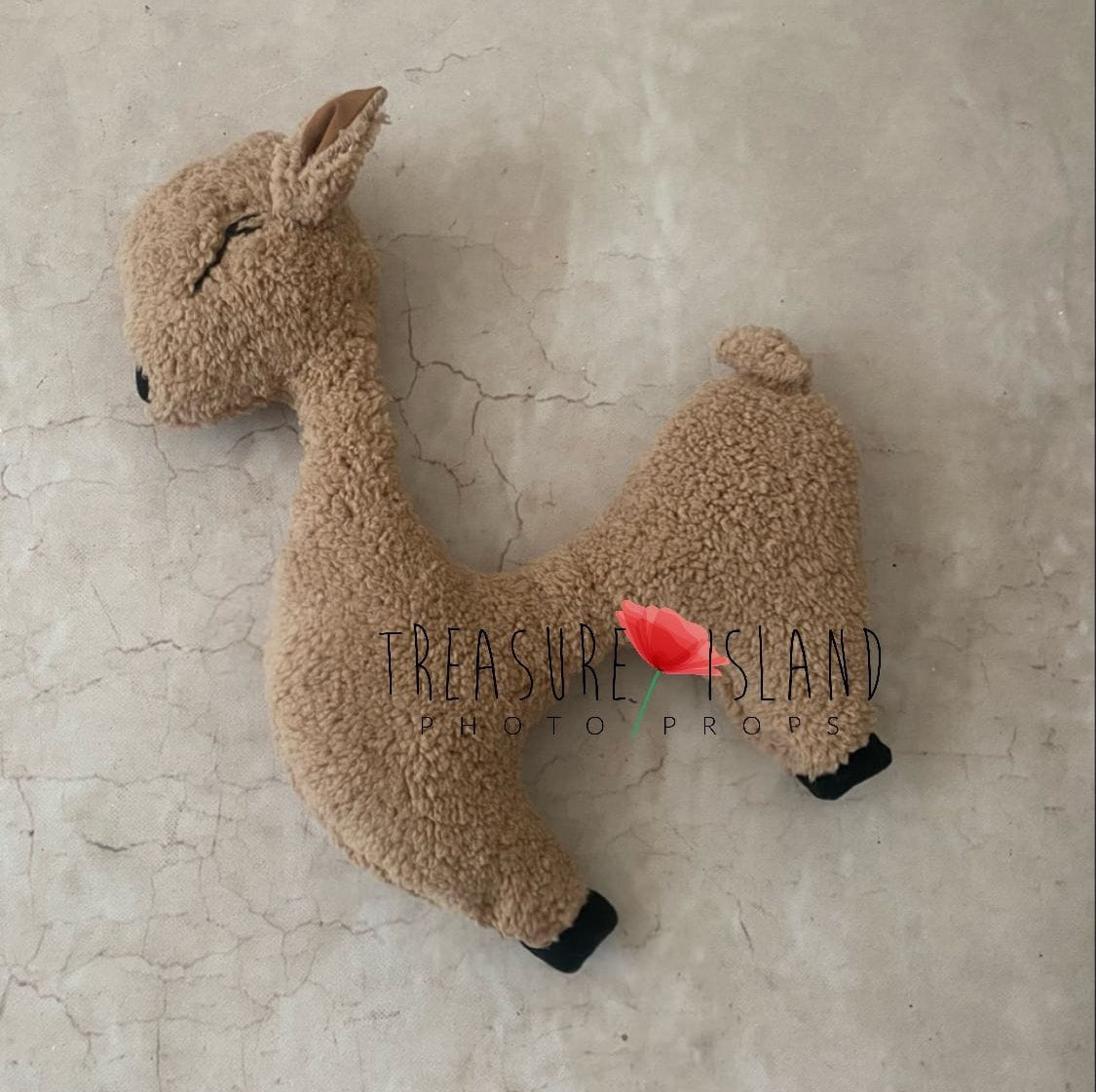 Warm beige lamb-shaped posing pillow for newborn photography sessions
