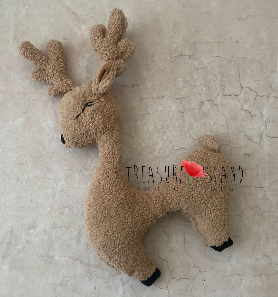 Warm beige reindeer newborn posing pillow with soft antlers and curved neck on light backdrop