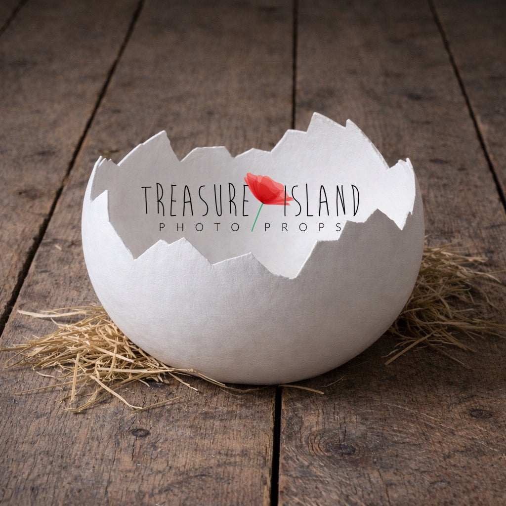 White handmade plaster eggshell with irregular broken edge for photography sessions