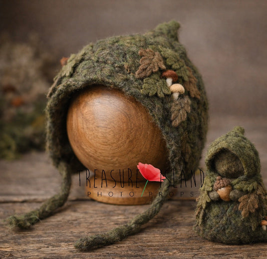 Hand-felted Woodland Forest Guardian newborn photography set with moss green bonnet, miniature forest figure, leaves and mushrooms
