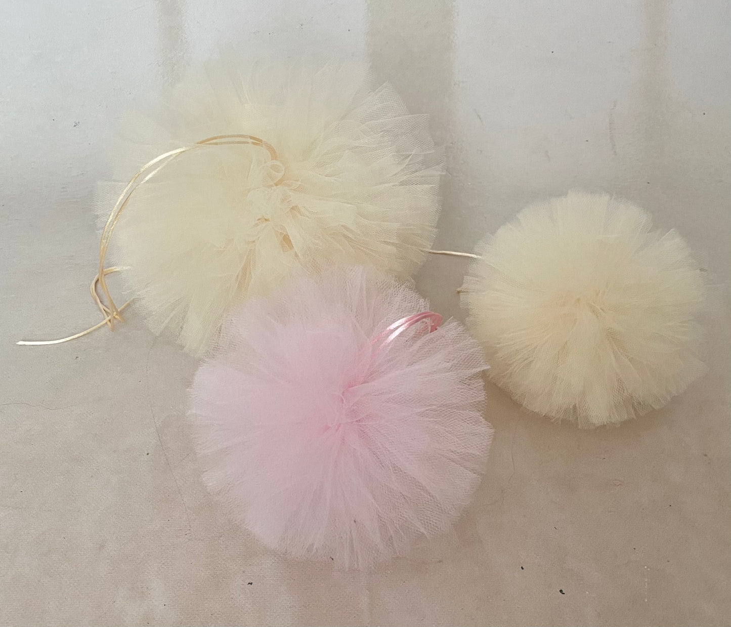 Blush Pink and Ecru tulle pom poms for Cake Smash and birthday photography