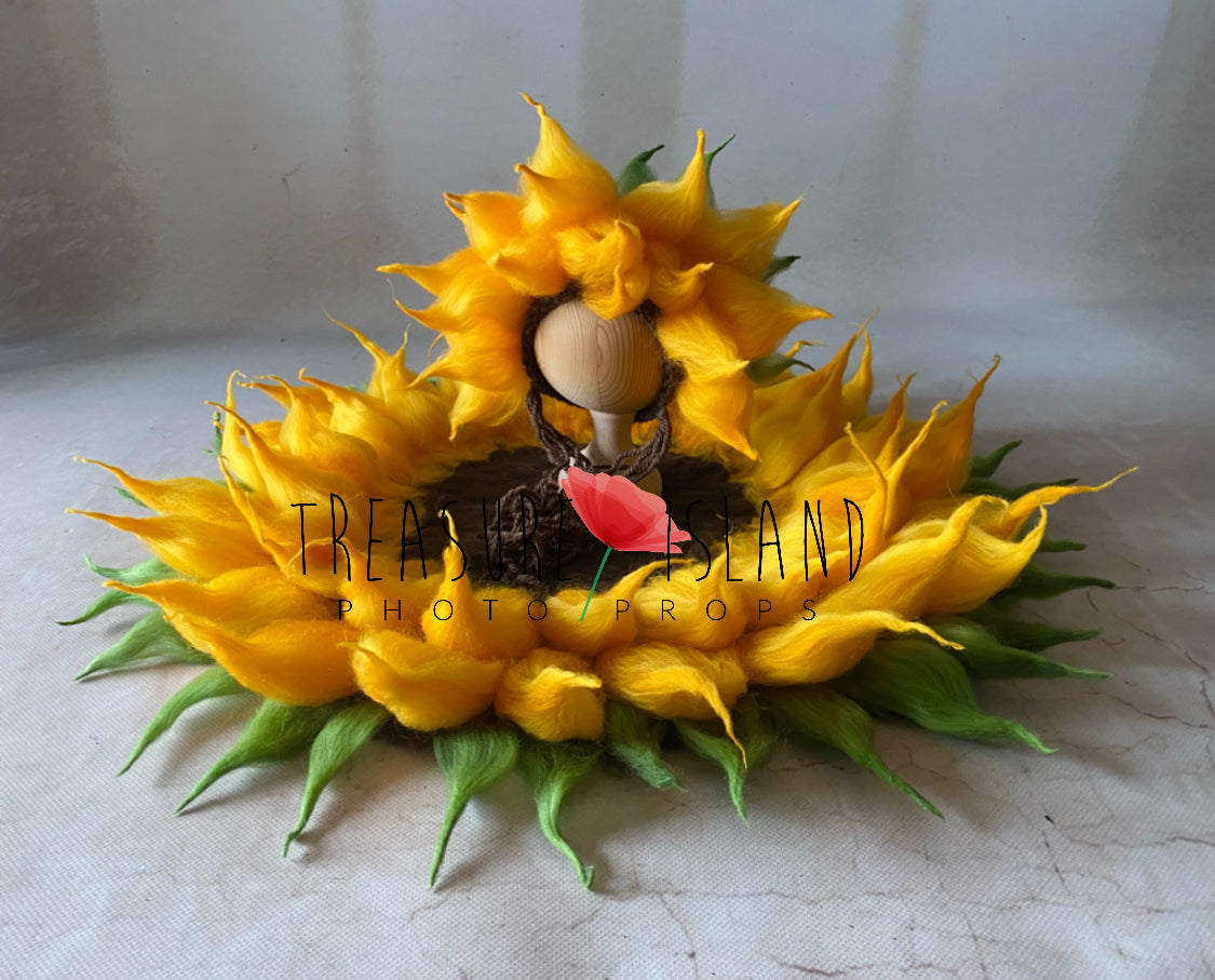 Felted sunflower bonnet placed inside matching flower posing blanket