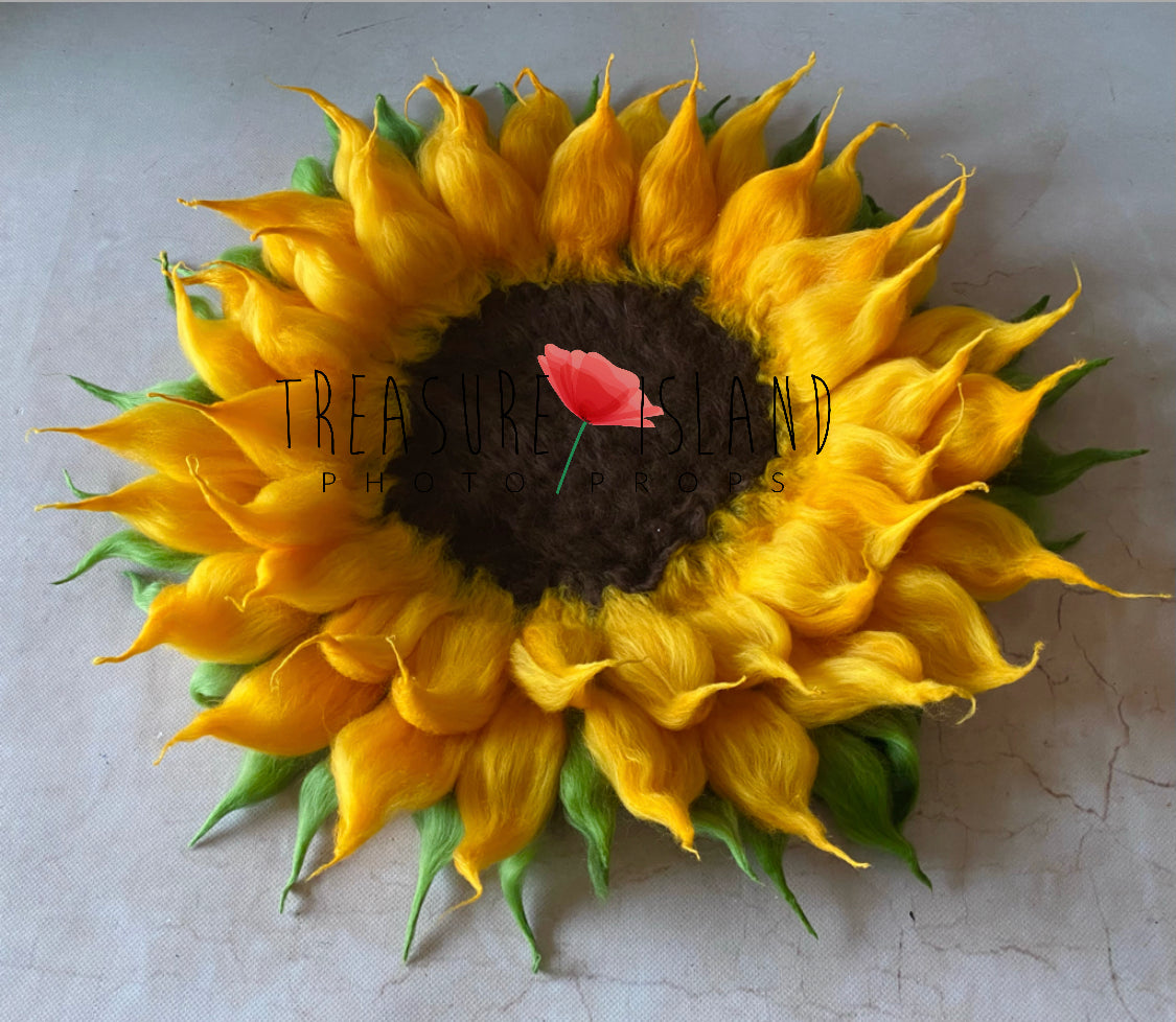 Handcrafted wool sunflower photography prop viewed from above