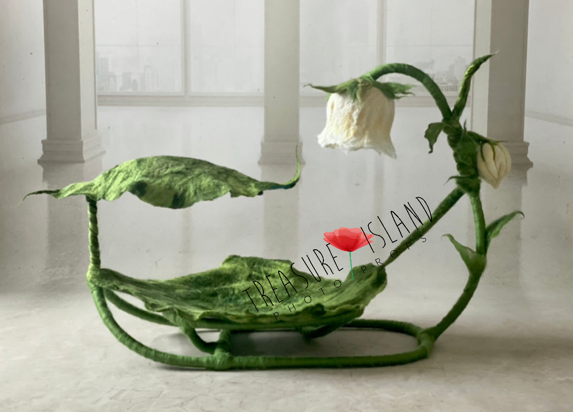 Handmade wool leaf hammock with sculptural flower and botanical leaf details