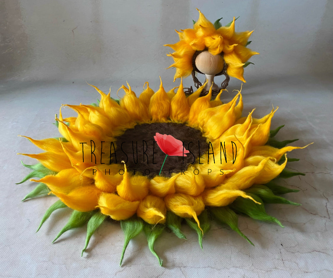 Matching felted sunflower bonnet displayed beside flower blanket