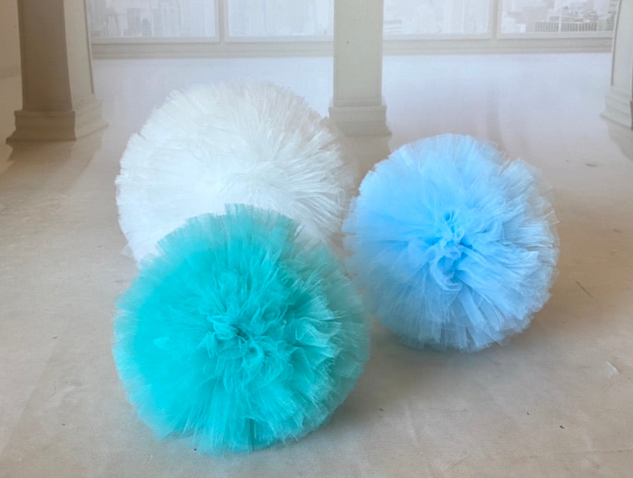 White, blue and turquoise tulle pom poms i for photography setups